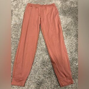 Vuori. Performance jogger. Burnt orange color. Size small.